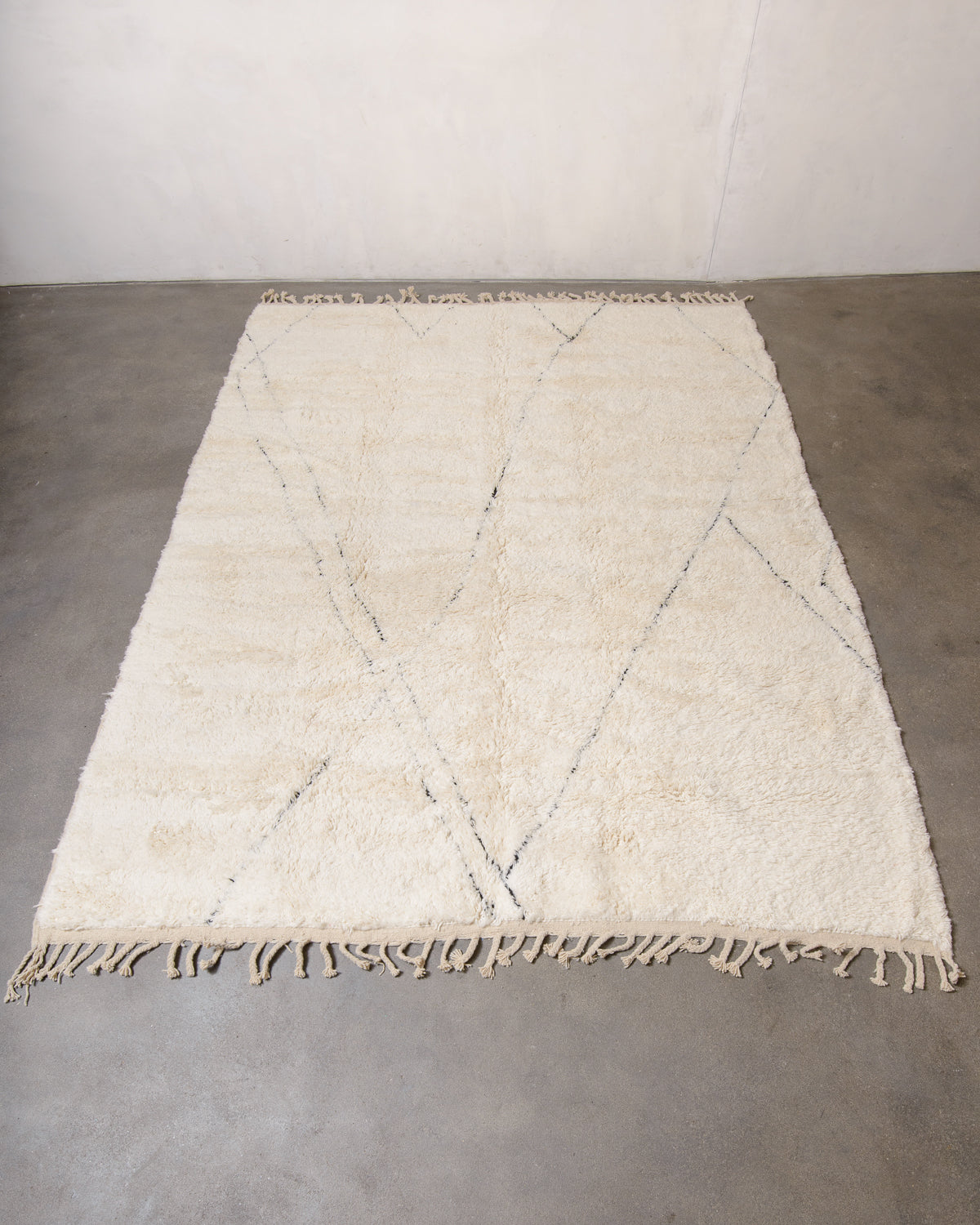 Modern, designer, handcrafted Berber rug from Morocco. Beniourain carpet with minimalist design, natural wool pile and a fluffy texture.
